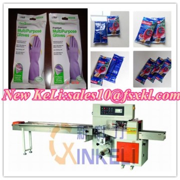 Glove flow packaging machine