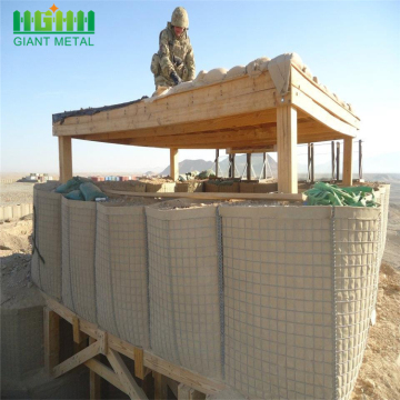 Army soldiers construct checkpoint quality hesco barriers