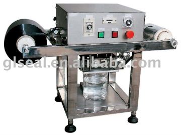 Plastic bottle sealing machine
