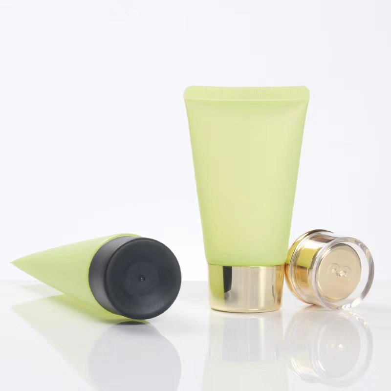 Vendita calda Crema solare cosmetica opaca con tubo in plastica verde glassata con coperchio acrilico a vite