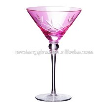 Martini glass with pink spraying and hand cutting.