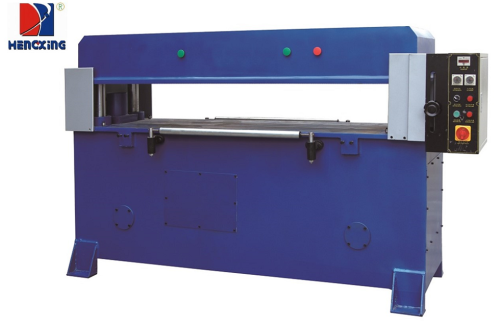 Auto-feeding hydraulic press cutting machine for clamshell