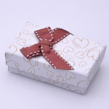 White paper gift wrappers with ribbon