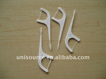 Flosser with toothpick brush