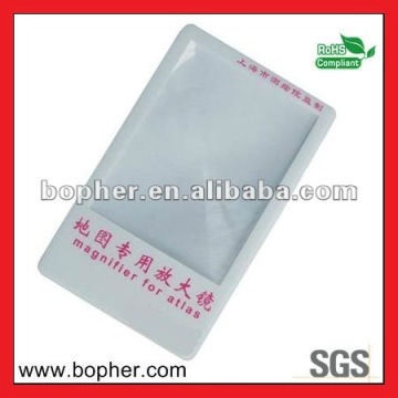 flat card magnifying glass and lamp