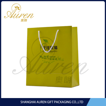 rigid white paper bag with gold foil stamped logo