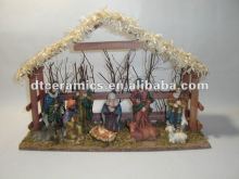 Cearmic nativity set with wooden house