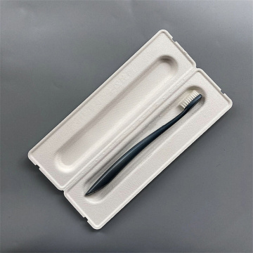 Biodegradable molded pulp box for toothbrush packaging