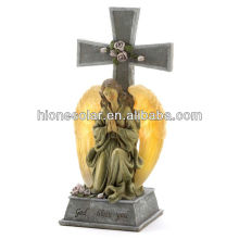Light-up solar praying angle cross statue
