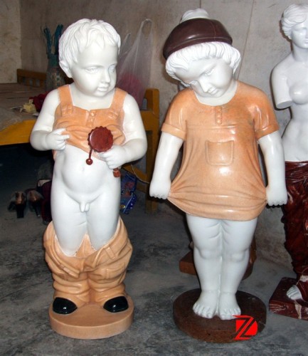 Boy and girl garden sculpture