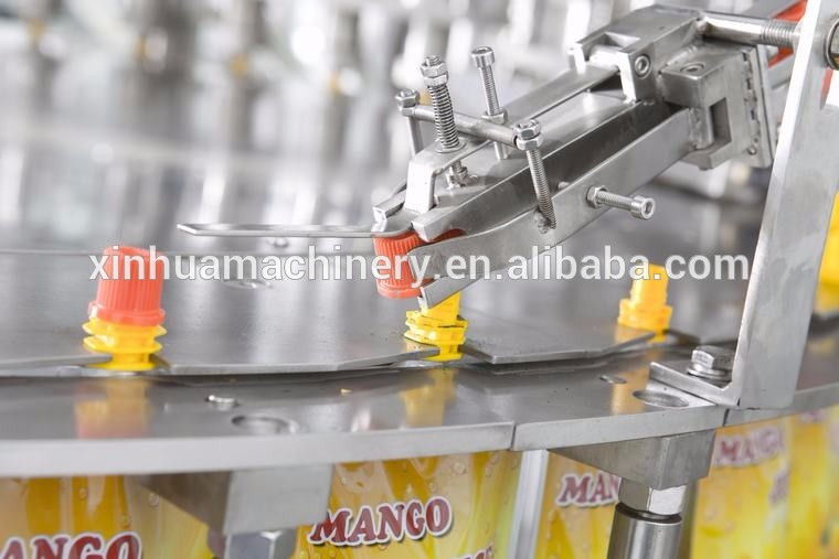 Automatic stand pouch spout pouch filling and packing machine capping machine
