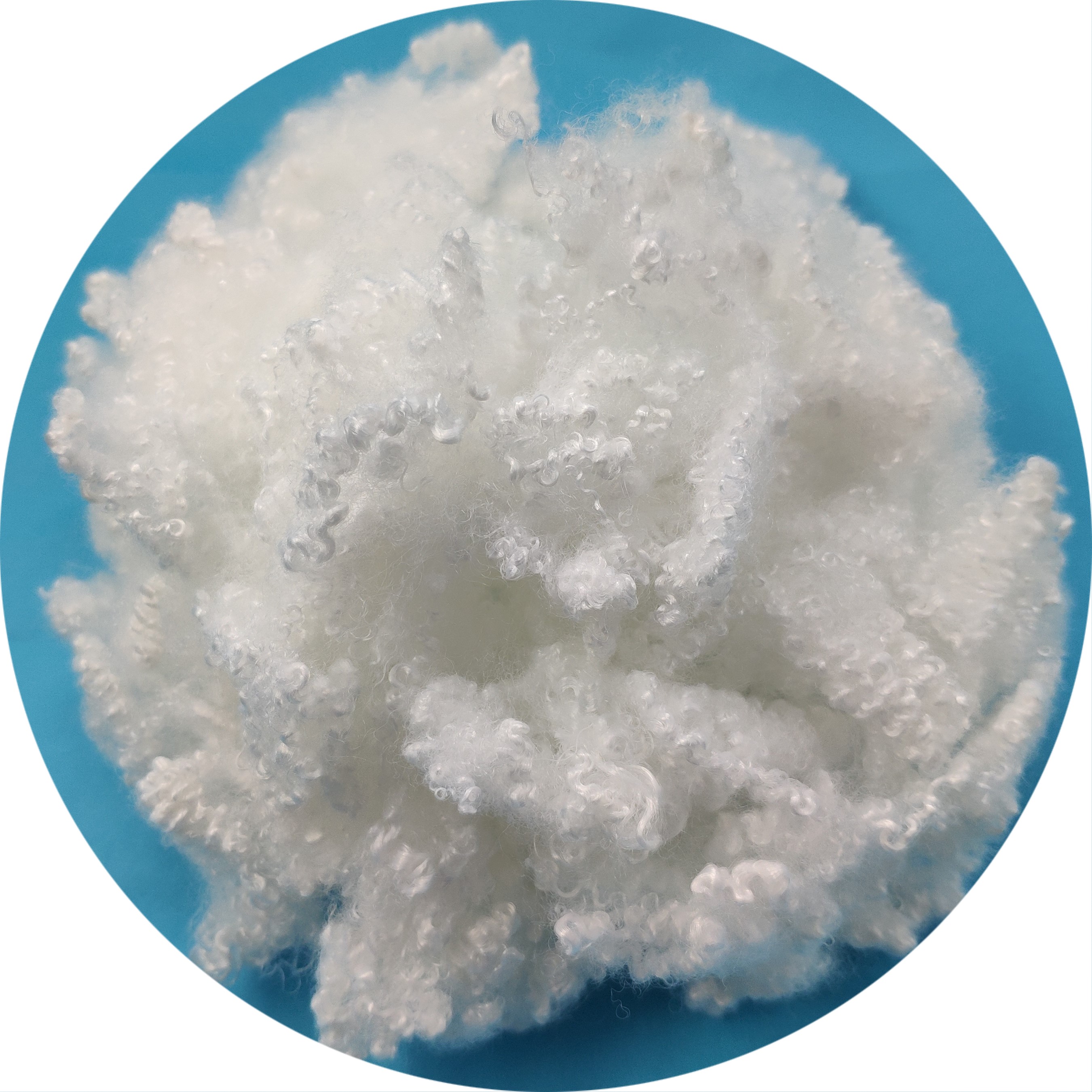 Siliconized solid polyester staple fiber