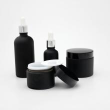 Set di bottiglie di vetro cosmetico nero