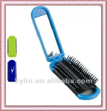 Plastic folding hairbrush with mirror