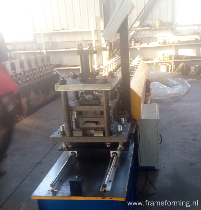 Roller shutter door forming machine with punching holes