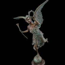 With large wings of butterfly fairies angel dancing on the ball of metal crafts sculpture
