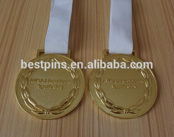 metal sport awarder gold medallions with white ribbon