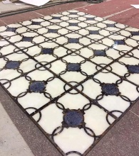 Customized composite marble waterjet floor pattern
