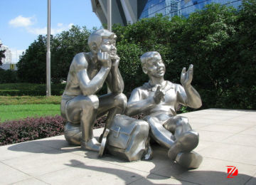 Stainless steel boy sculpture