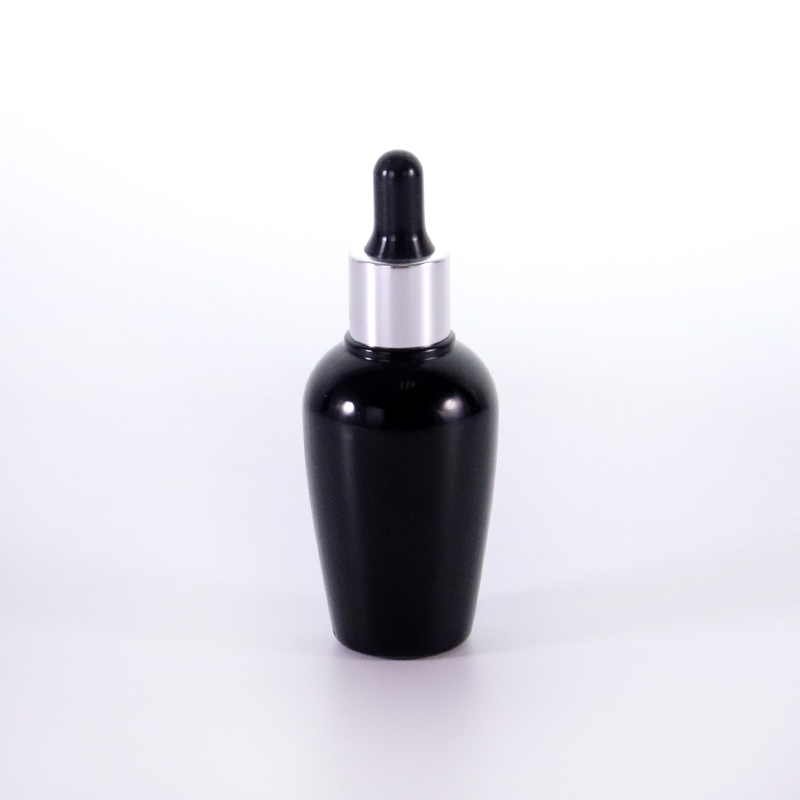 زجاجة زجاجية سوداء مع غطاء قطرة فضية