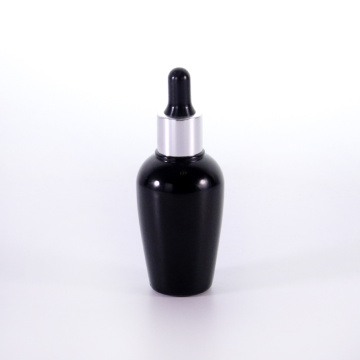 Black glass bottle with silver dropper cap