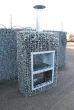 Gabion fireplace combines with stone