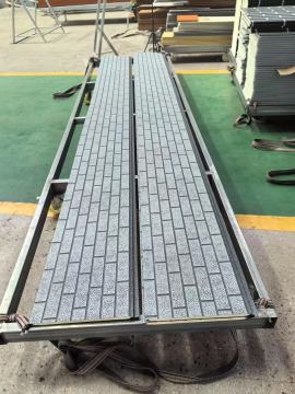 Metal Carved Panels With Water Patterns Covering Brick Patterns