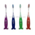 Brosse à dents enfant de bébé de poils doux heureux visage avec ventouse