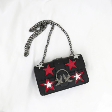 Star decorative leather shoulder bag