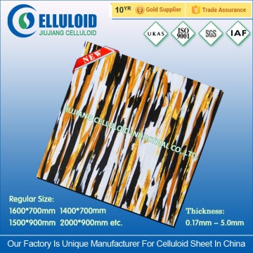 Rigid plastic sheet for drum decoration wraps