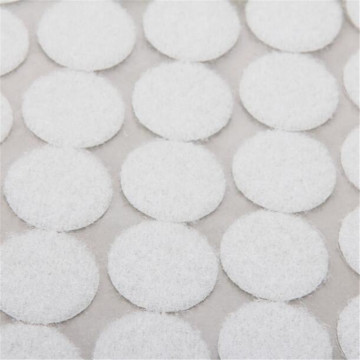 Sticky hook and loop coin with adhesive tape