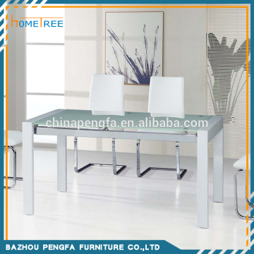 Modern design tempered glass top wooden base extendable dining table/cheap restaurant table
