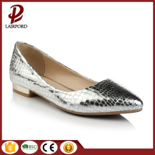 Pointed-toe pump featuring curved flat heel