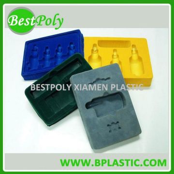 Plastic insert tray for cosmetic bottle