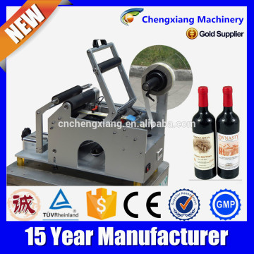 Manual adhesive labeling machines for round bottle,manual wine bottle labeling machine,wine bottle labeling machine