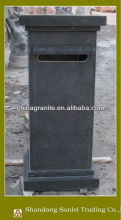 carved stone mailbox