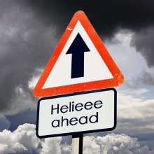 Triangular warning signs narrows down crossroads ahead