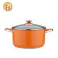 Cookware de cor laranja com alça de ouro rosa