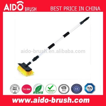 Telescopic flow-through car wash brush