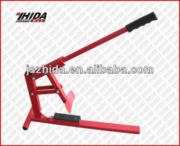 Manual tire changer/tire changing tool