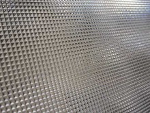 Light diffusing prismatic sheet for advertising