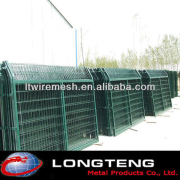 Green metal wire mesh fence Highway guardrail