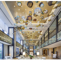 Amber chandelier in the center of hotel lobby