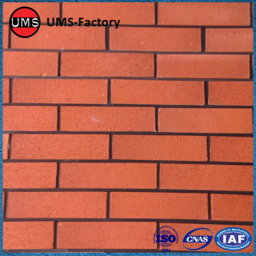 Faux exposed red brick tiles wall