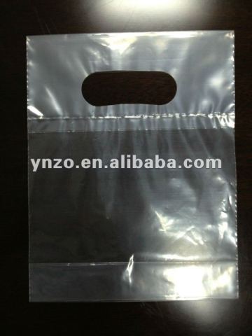 Die cut handle plastic bag with fold over reinforce handle