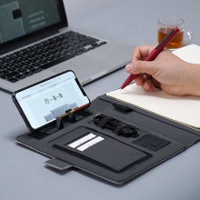 Multifunctional Notebook Power Bank with Wireless Charger, Phone Holder, and Office Agenda