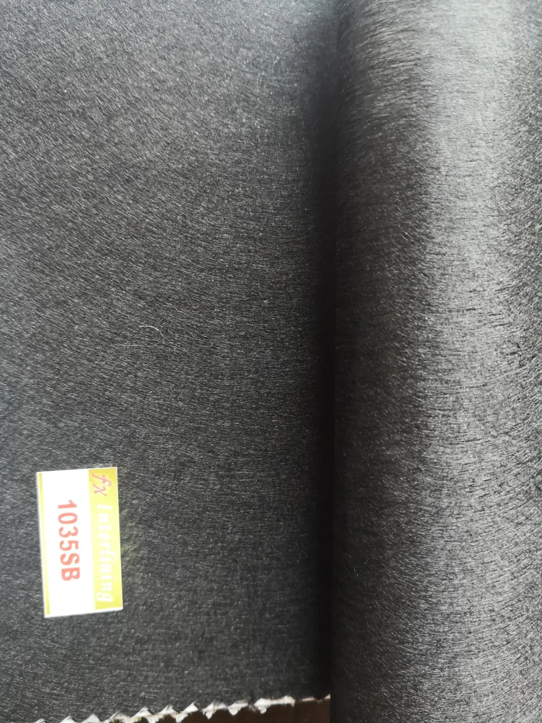 Borong 100% poliester panas fius nonwoven interlining fabric