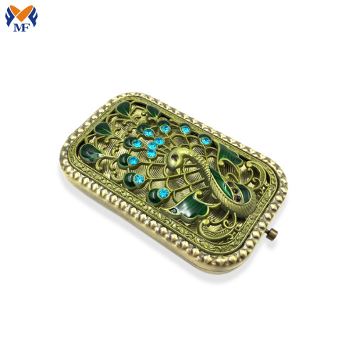 Mini square pocket mirror with peacock logo