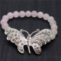 Bracelet de pierres précieuses extensibles de perles rondes de quartz rose 8MM avec un grand morceau de papillon en alliage Diamante