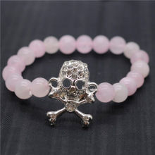 Bracelet de pierres précieuses tendues avec perles rondes de quartz rose 8MM avec pièce de tête de mort Diamante